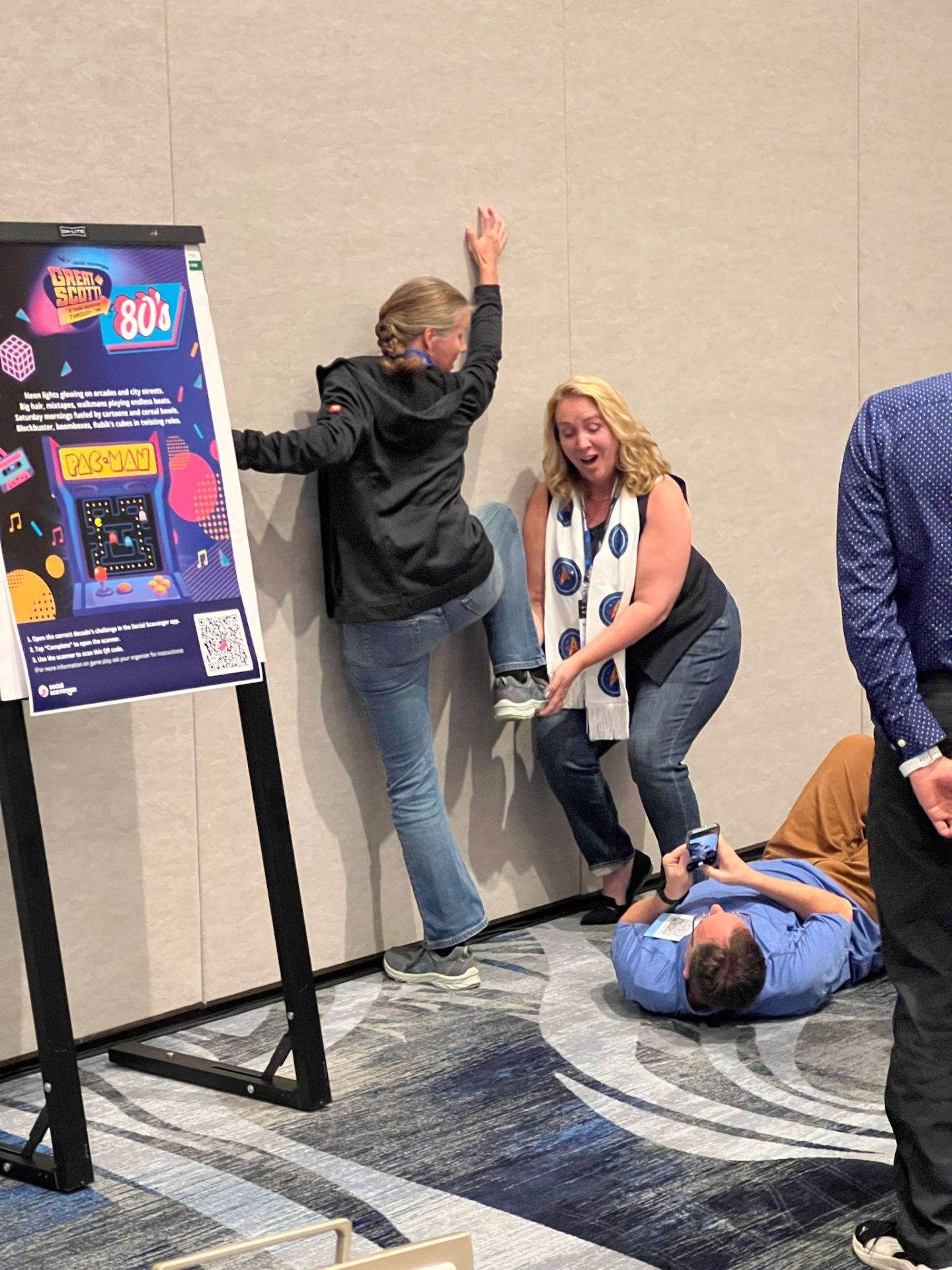 Corporate group playing an indoor Interactive Poster Game at their venue